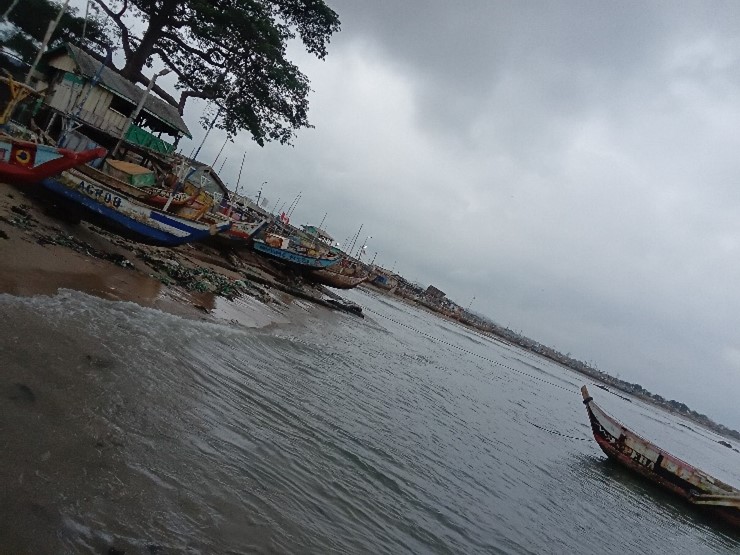 Canoes berthed along the beach observed complying with the closed season in Apam