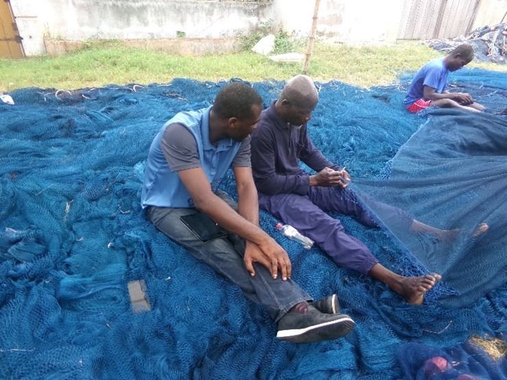 Fisherman at Cape Coast Ola being engaged in a survey