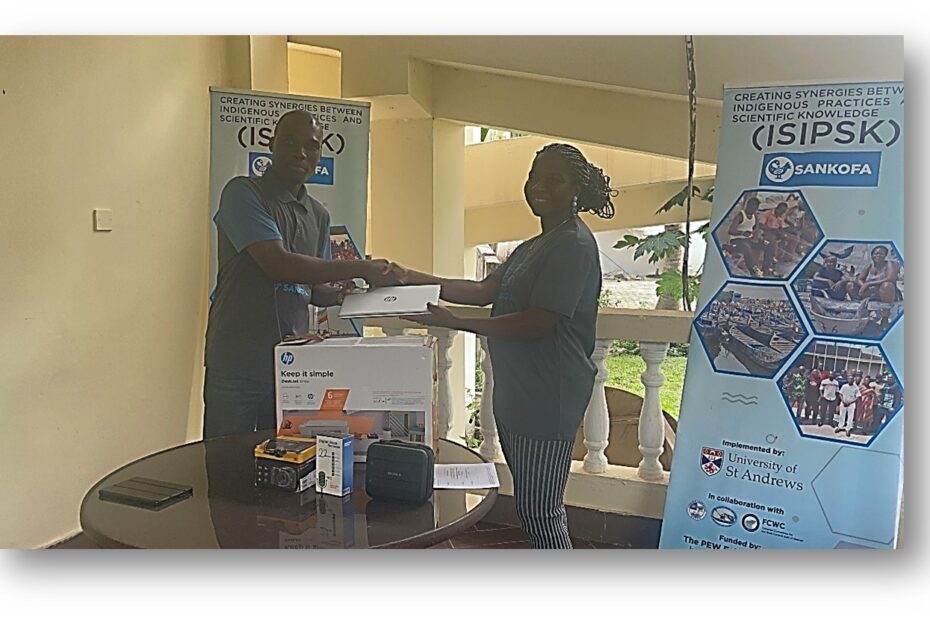 The research lead, Dr Okafor-Yarwood (positioned on the right), handing over equipment in a handshake to the President of CaFGOAG, Nana Kweigyah (positioned on the left).