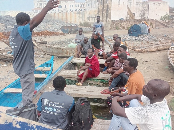Focus group discussion with crew fishermen in Abrofo mpoano and the Cape Coast castle in the background